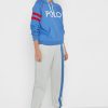 Béžové dámské pruhované tepláky Ralph Lauren Béžové dámské pruhované tepláky Ralph Lauren